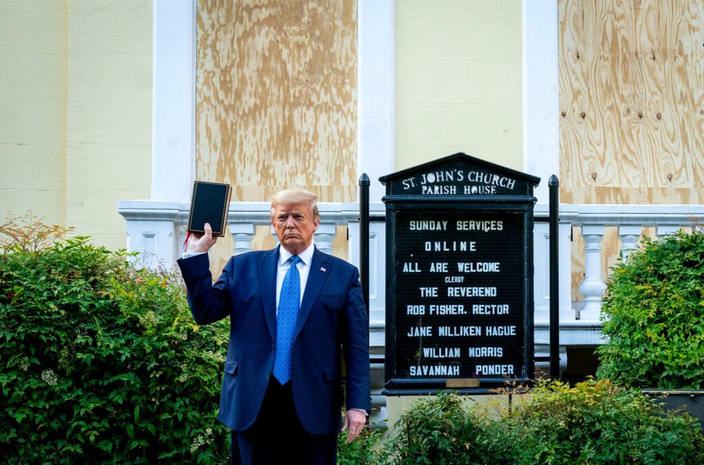 After having police and National Guard units disperse protestors with flash-bang and tear gas munitions, President Trump posed for media with a bible in front of St. John’s Church.Credit...Doug Mills/The New York Times
